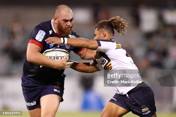 Cabous Eloff of the Melbourne Rebels is tackled during the round three Super RugbyAU match between the Melbourne Rebels and the Brumbies at GIO...