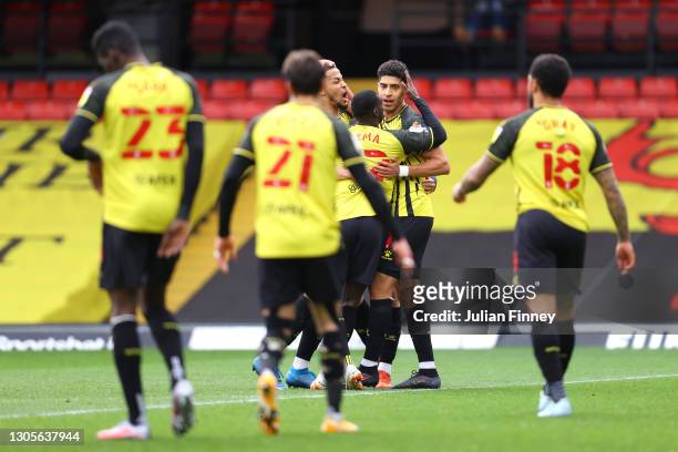 Adam Masina of Watford celebrates with teammates after scoring his team's first goal during the Sky Bet Championship match between Watford and...