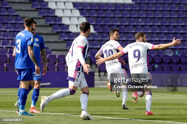 Oscar Plano of Real Valladolid celebrates with teammate Shon Weissman after scoring his team's first goal during the La Liga Santander match between...