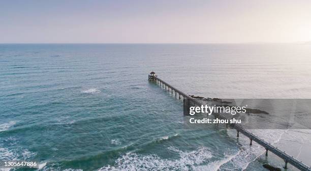 the bay sunset of the long pier in bo'ao, hai nan - boao economic forum stock pictures, royalty-free photos & images