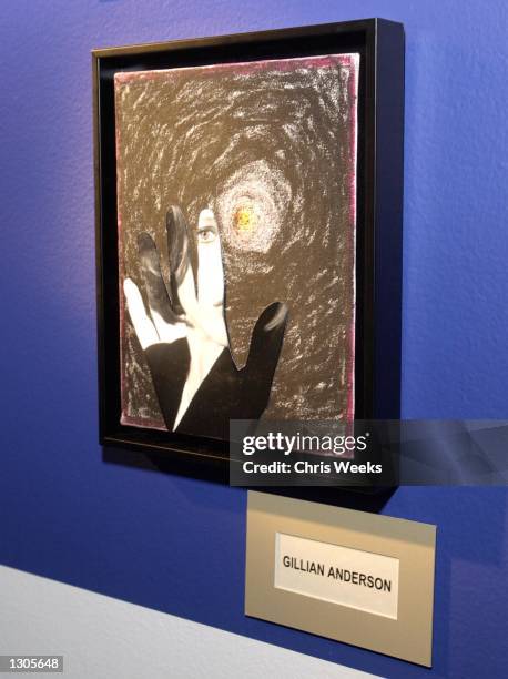 Artwork created by actress Gillian Anderson is displayed at the launch of AOL''s "Helping Hands" holiday initiative November 9, 2000 at Track 16...