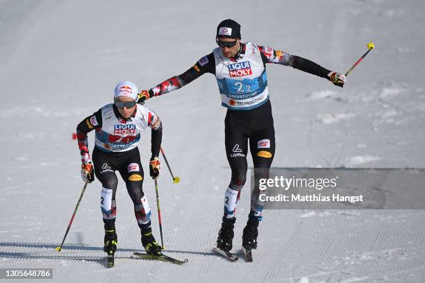 Johannes Lamparter and Johannes Lamparterof Austria change in the cross-country leg during the Men's Nordic Combined Team HS137/4x7.5 Km at the FIS...