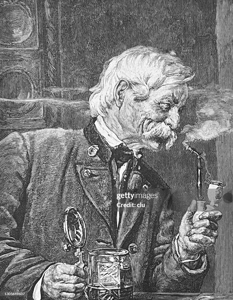 Happy senior bavarian man with beer mug and pipe