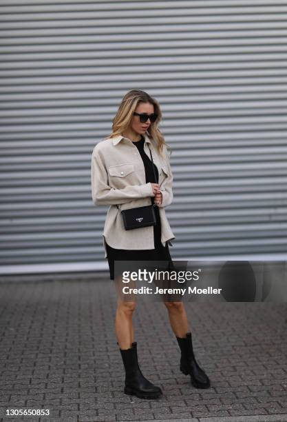 Scarlett Gartmann wearing Isabel Marant beige jacket, Celine shades, The Frankie Shop black dress, Copenhagen Studios black boots and Prada mini bag...