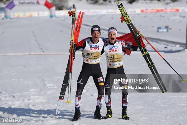 Johannes Lamparter of Austria and Lukas Greiderer of Austria celebrate after winning the Men's Nordic Combined Team HS137/4x7.5 Km at the FIS Nordic...