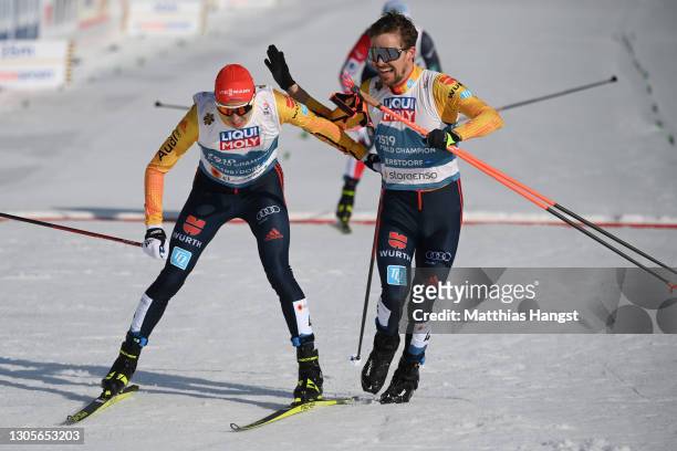 Eric Frenzel and Fabian Riessle of Germany celebrate third place of the Men's Nordic Combined Team HS137/4x7.5 Km at the FIS Nordic World Ski...