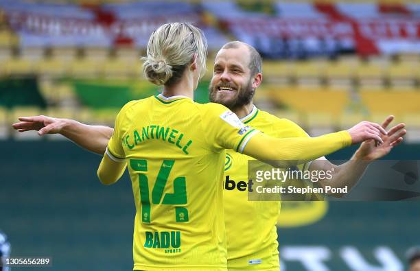 Teemu Pukki of Norwich City celebrates with teammate Todd Cantwell after scoring his team's first goal during the Sky Bet Championship match between...