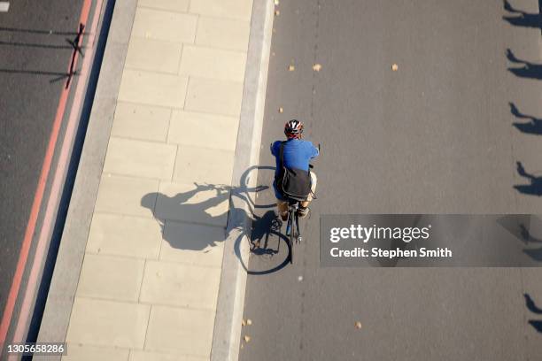 cycling through the city - smith street stock pictures, royalty-free photos & images