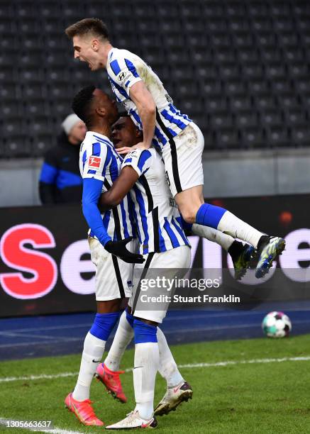 Dodi Lukebakio of Hertha BSC celebrates with teammates Jhon Cordoba and Krzysztof Piatek after scoring his team's second goal during the Bundesliga...