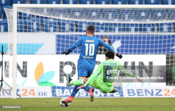 Paulo Otavio of VfL Wolfsburg fouls Munas Dabbur of TSG 1899 Hoffenheim during the Bundesliga match between TSG Hoffenheim and VfL Wolfsburg at...