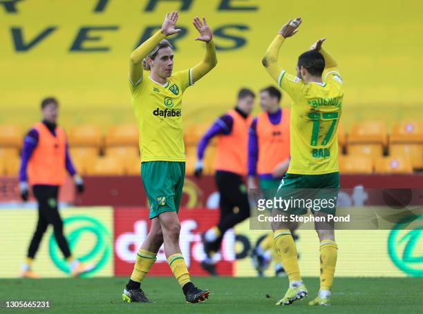 Todd Cantwell of Norwich City celebrates with teammate Emiliano Buendia after scoring his team's third goal during the Sky Bet Championship match...