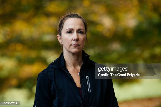 portrait of confident mature woman standing outdoors - grave bildbanksfoton och bilder