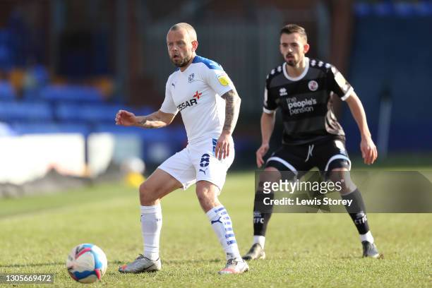 Jay Spearing of Tranmere Rovers makes a pass whilst under pressure from Jack Powell of Crawley Town during the Sky Bet League Two match between...