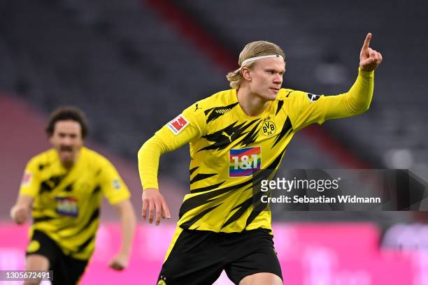 Erling Haaland of Borussia Dortmund celebrates after scoring their team's first goal during the Bundesliga match between FC Bayern Muenchen and...
