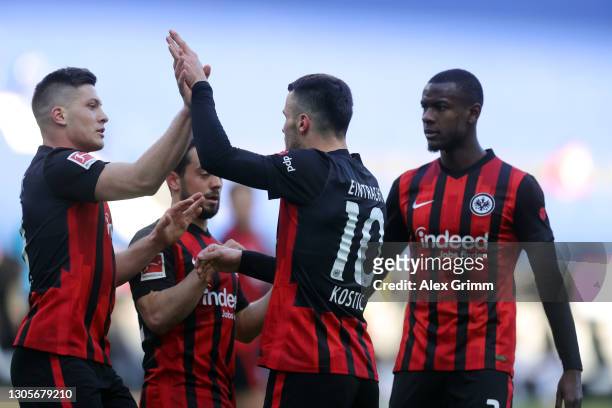Filip Kostic of Frankfurt celebrates his team's first goal with teammates Luka Jovic Amin Younes and Evan N'Dicka during the Bundesliga match between...