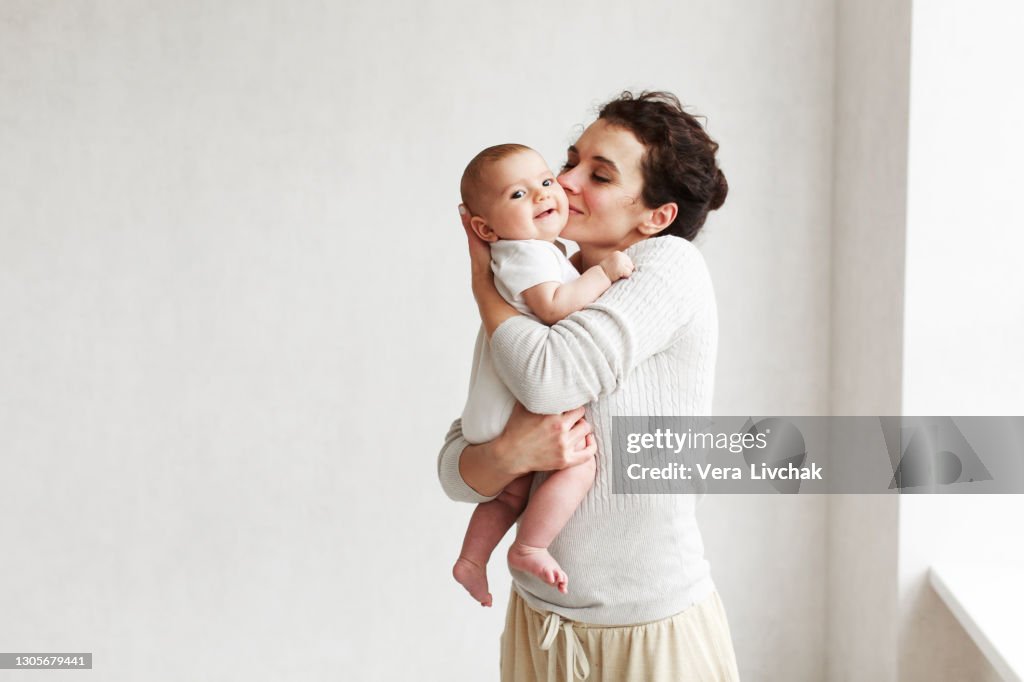 Woman with baby on white background