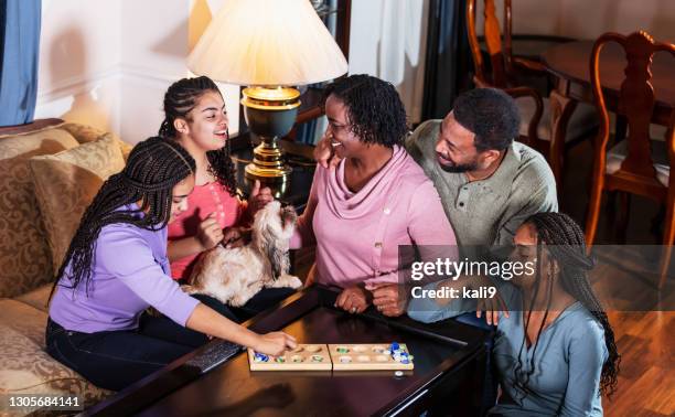 african-american family at home playing board game - wari imagens e fotografias de stock