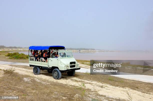 dakar lake retba tourist truck - senegal landscape stock pictures, royalty-free photos & images