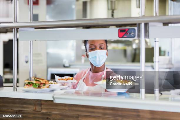 restaurant cook  with finished order, wearing face mask - black glove stock pictures, royalty-free photos & images