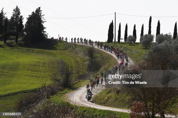 The Peloton passing through a gravel strokes sector during the Eroica - 15th Strade Bianche 2021, Men's Elite a 184km race from Siena to Siena -...