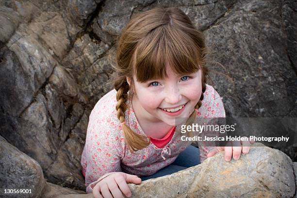 portrait of girl playing in rocks - jamestown stock pictures, royalty-free photos & images