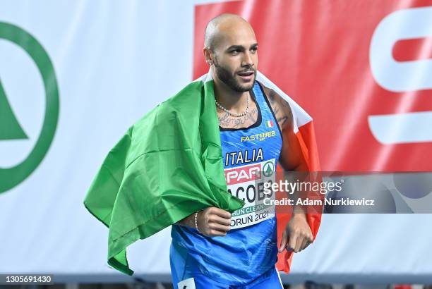 Lamont Marcell Jacobs of Italy celebrates after winning the Men's 60 metres final during the second session on Day 2 of European Athletics Indoor...