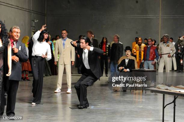 Uma Thurman and John Travolta act a scene from Pulp Fiction as Tom Hanks from Forrest Gump and Charlie Chaplin look on, The Hollywood Wax Museum...