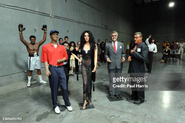 Muhammad Ali cheers behind Tiger Woods, Cher, Jay Leno and Rodney Dangerfield, The Hollywood Wax Museum auctioned all these figures May 4th 2009 one...