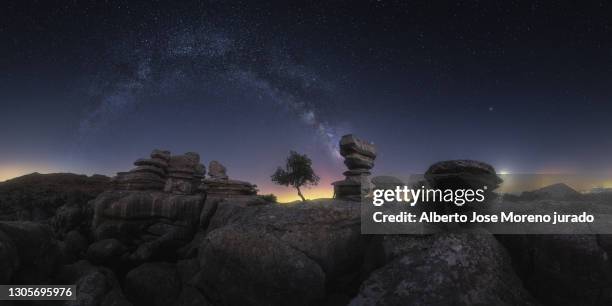 night view of karstic rocky landscape against the milky way - paraje natural torcal de antequera stock pictures, royalty-free photos & images