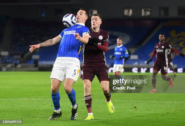 Lewis Dunk of Brighton & Hove Albion and Jamie Vardy of Leicester City battle for the ball during the Premier League match between Brighton & Hove...