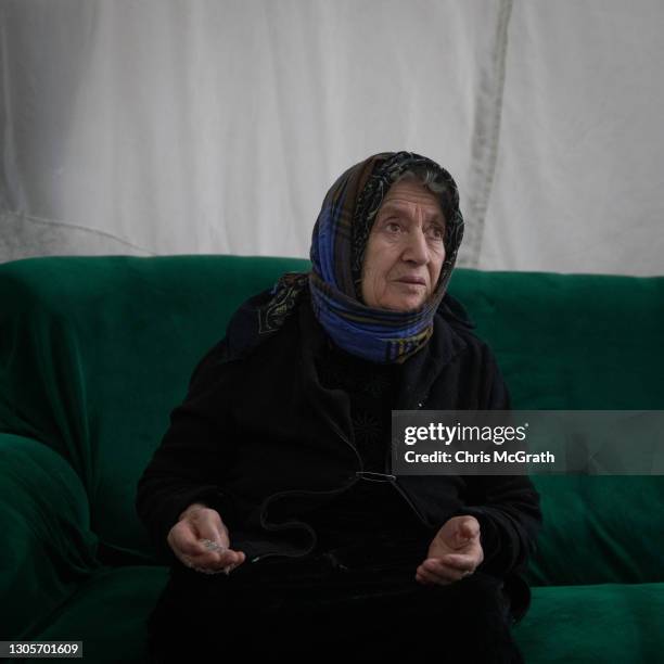 Year-old Samia Mansour Elias who fled her home in Qaraqosh in 2014, poses for a portrait in her temporary home on the empty fifth floor of a shopping...