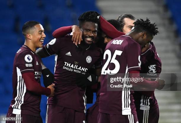 Daniel Amartey of Leicester City celebrates with Youri Tielemans after scoring their team's second goal during the Premier League match between...