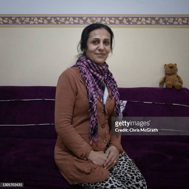 Am happy because its his first time, its historic" said Harlin Samir Shamon, who fled her home in Bartella in 2014, while posing for a portrait in...