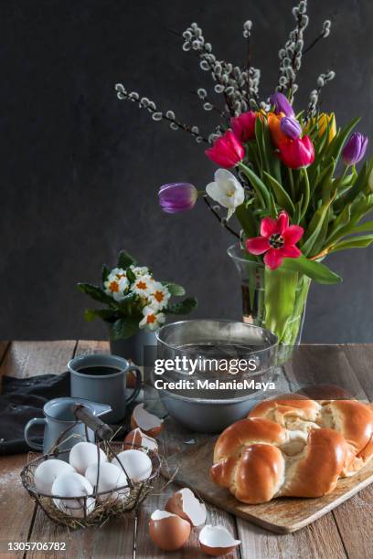 baking easter buns yeast bread brioche in rustic kitchen - easter breakfast stock pictures, royalty-free photos & images
