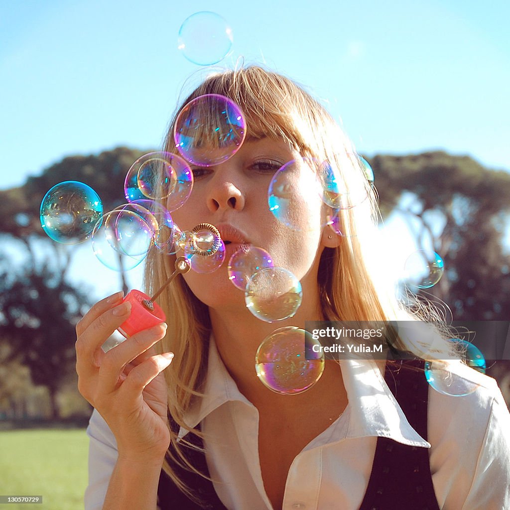 Woman blowing bobbles