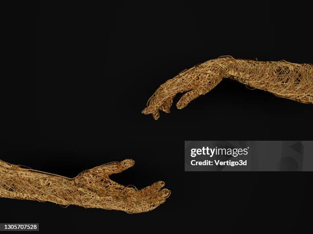 golden wired human hands - man and machine stock pictures, royalty-free photos & images
