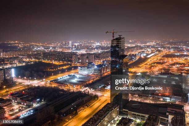 aerial view of west 65 tower during construction at night - belgrade skyline imagens e fotografias de stock