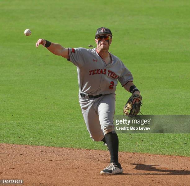 Jace Jung of the Texas Tech Red Raiders throws to first base against the Sam Houston State Bearkats at Minute Maid Park on March 06, 2021 in Houston,...