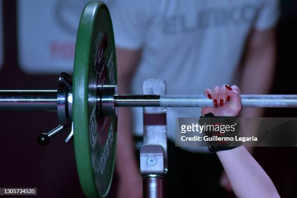 Detail whilw Nino Sabashvili of Georgia competes in the women's up to 73 kg category at the Para Powerlifting World Cup on March 06, 2021 in Bogota,...