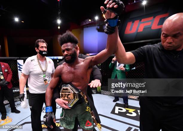 Aljamain Sterling reacts after his victory by disqualification over Petr Yan of Russia due to an intentional foul in their UFC bantamweight...