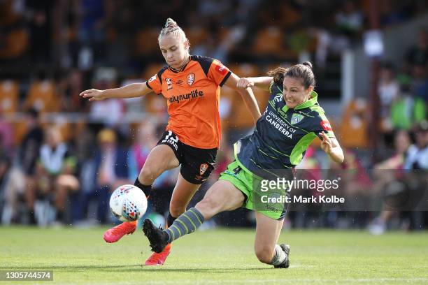Tameka Yallop of the Brisbane Roar is tackled by Kendall Fletcher of Canberra United during the round 11 W-League match between Canberra United and...