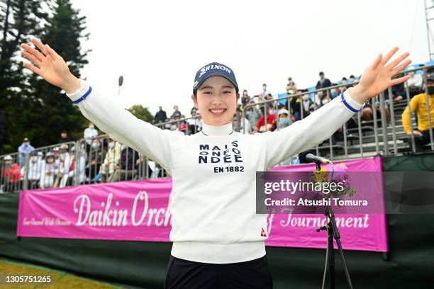 Sakura Koiwai celebrates after winning the tournament after the final round of the Daikin Orchid Ladies at the Ryukyu Golf Club on March 7, 2021 in...