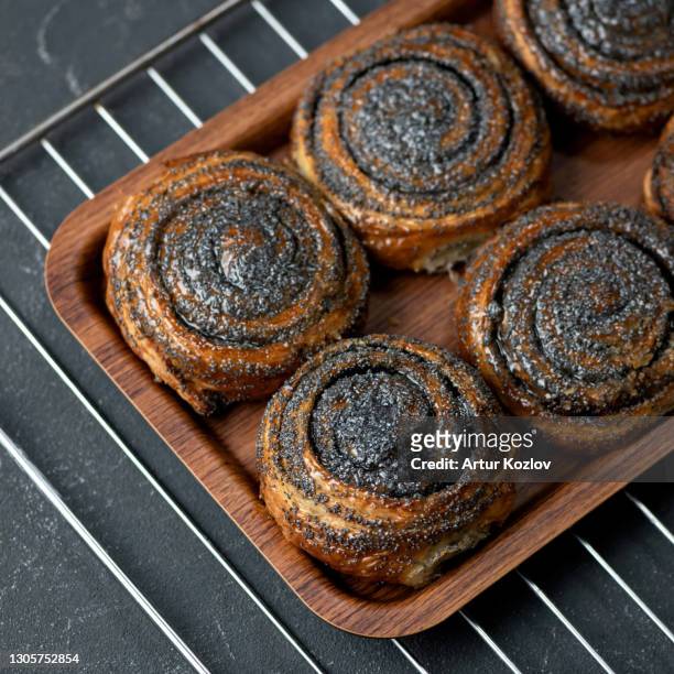 sweet buns with poppy seeds fresh from the oven. pastries, dessert food. delicious morning concept. square format or 1x1 for posting on social media - poppy seed stock pictures, royalty-free photos & images