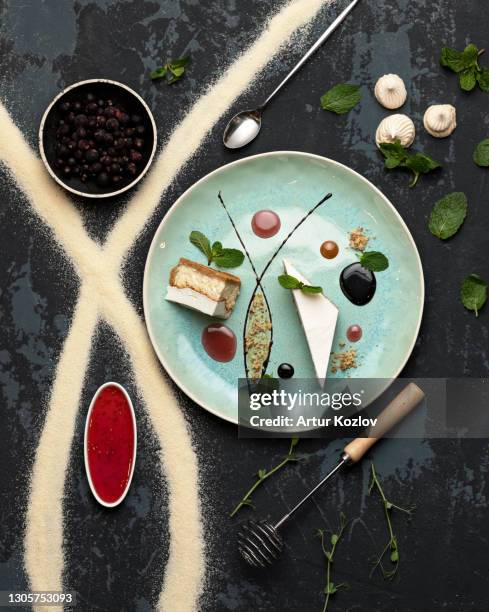 serving of desserts. sweet food plate in restaurant. top view. romantic sweet gift or present for beloved person. holiday or festive mood concept. exquisite goodiesfor refined taste. vertical format 4x5 - calcio sport imagens e fotografias de stock