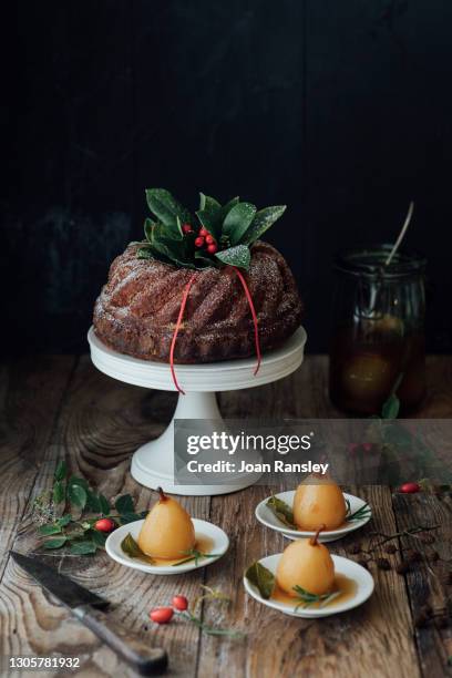 chocolate, hazelnut and orange bundt cake - christmas cake stock pictures, royalty-free photos & images