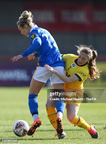 Emily Simpkins of Brighton & Hove Albion is challenged by Angela Addison of Tottenham Hotspur during the Barclays FA Women's Super League match...