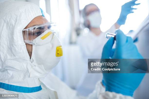 researcher with human blood sample. - genomics stock pictures, royalty-free photos & images