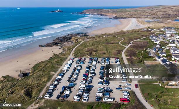 The Gwithian Towans Beach car park is full as surfers head for the sea on March 07, 2021 in Gwithian, United Kingdom.