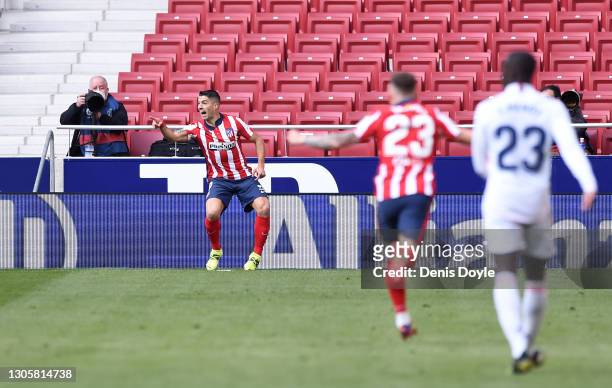 Luis Suarez of Atletico de Madrid celebrates after scoring their side's first goal during the La Liga Santander match between Atletico de Madrid and...