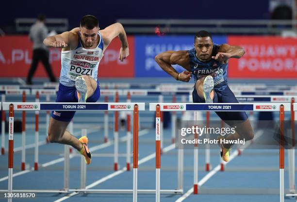 Andy Pozzi of Great Britain and Wilhem Belocian of France compete in Men's 60 Metres Hurdles during the second session on Day 3 of the European...